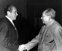 A picture of Nixon and Mao shaking hands.